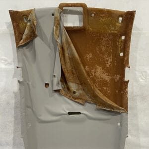Roof Lining Restoration Processing Step 2: Roof lining fabric has naturally detached, exposing the roof board with a thick layer of adhesive residue from melted foam. The roof board has just been removed from the vehicle and is ready for restoration.