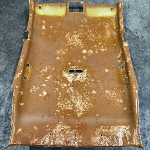 Roof Lining Restoration Processing Step 3: Roof board covered with a thick layer of adhesive residue left from the melted foam after the old roof lining fabric was removed.