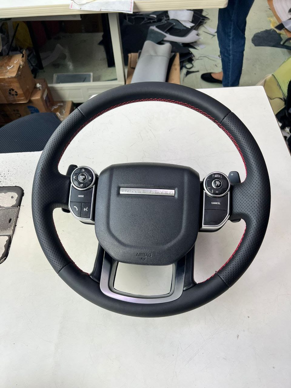 Range Rover Sport HSE steering wheel wrapped in perforated Nappa leather with red stitching