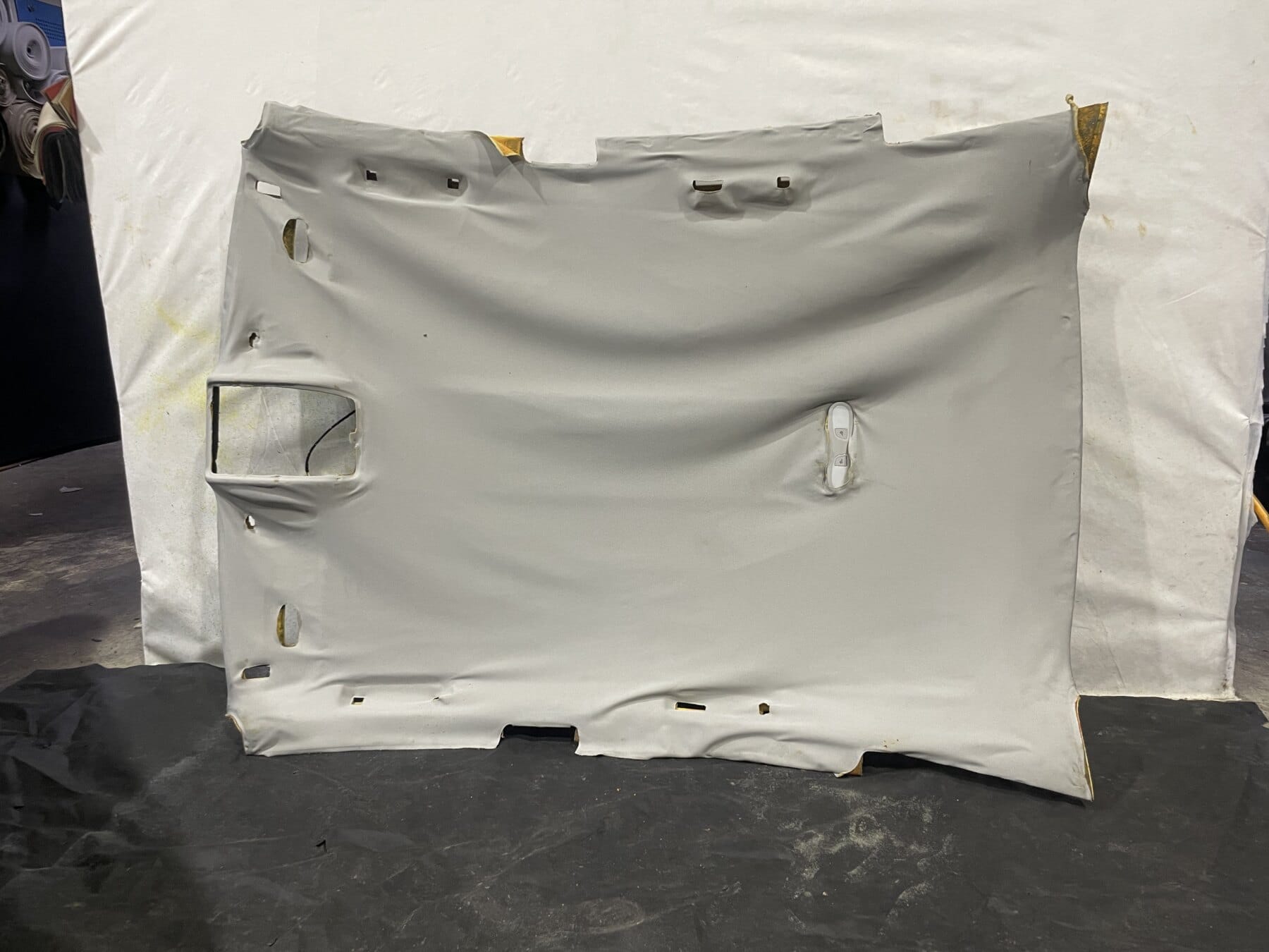 Removed Audi A7 Sportback C7 4G headliner with detached fabric before roof lining repair