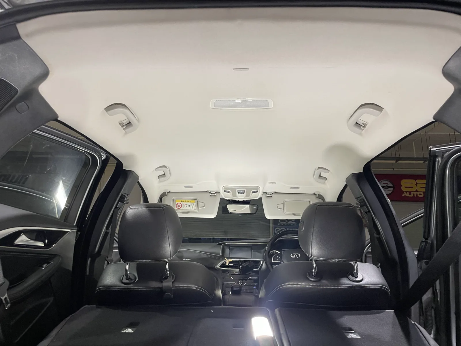 Actual car interior after complete roof lining headliner fabric replacement and reinstallation