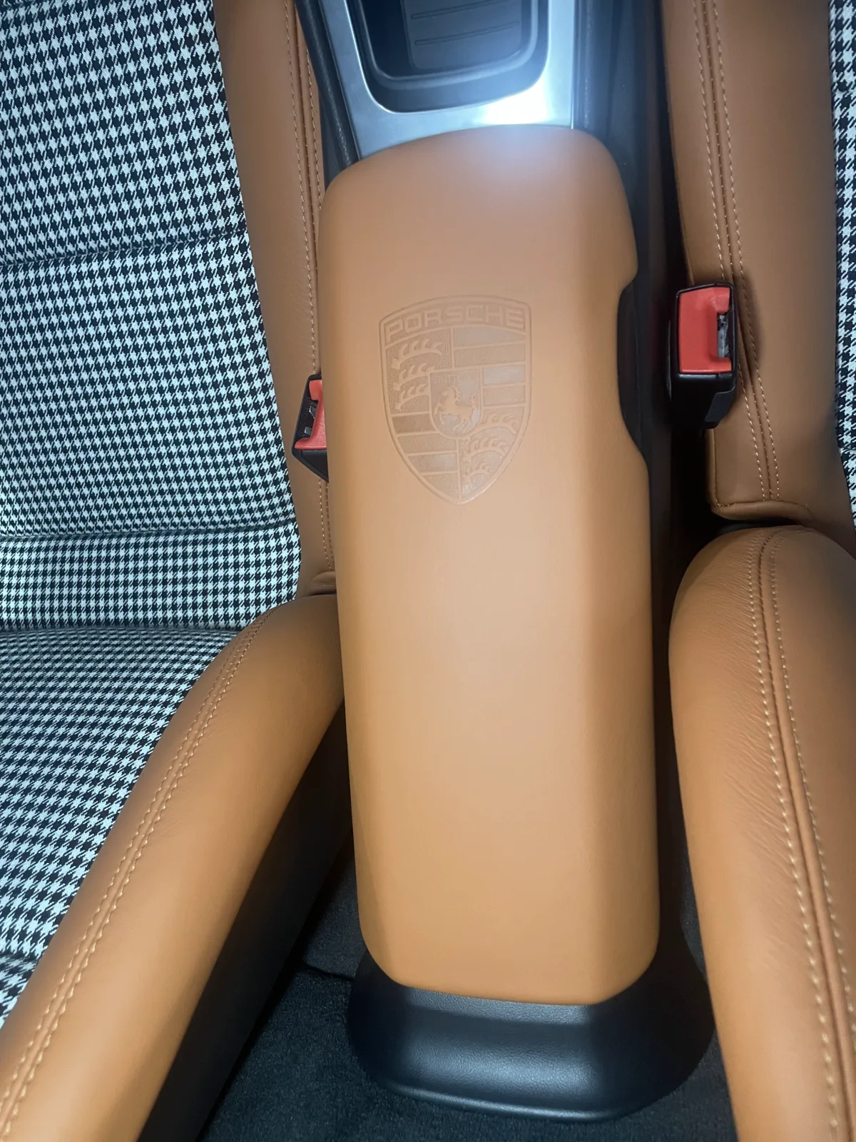 Cognac leather Porsche Cayman 981 centre armrest with embossed Porsche crest