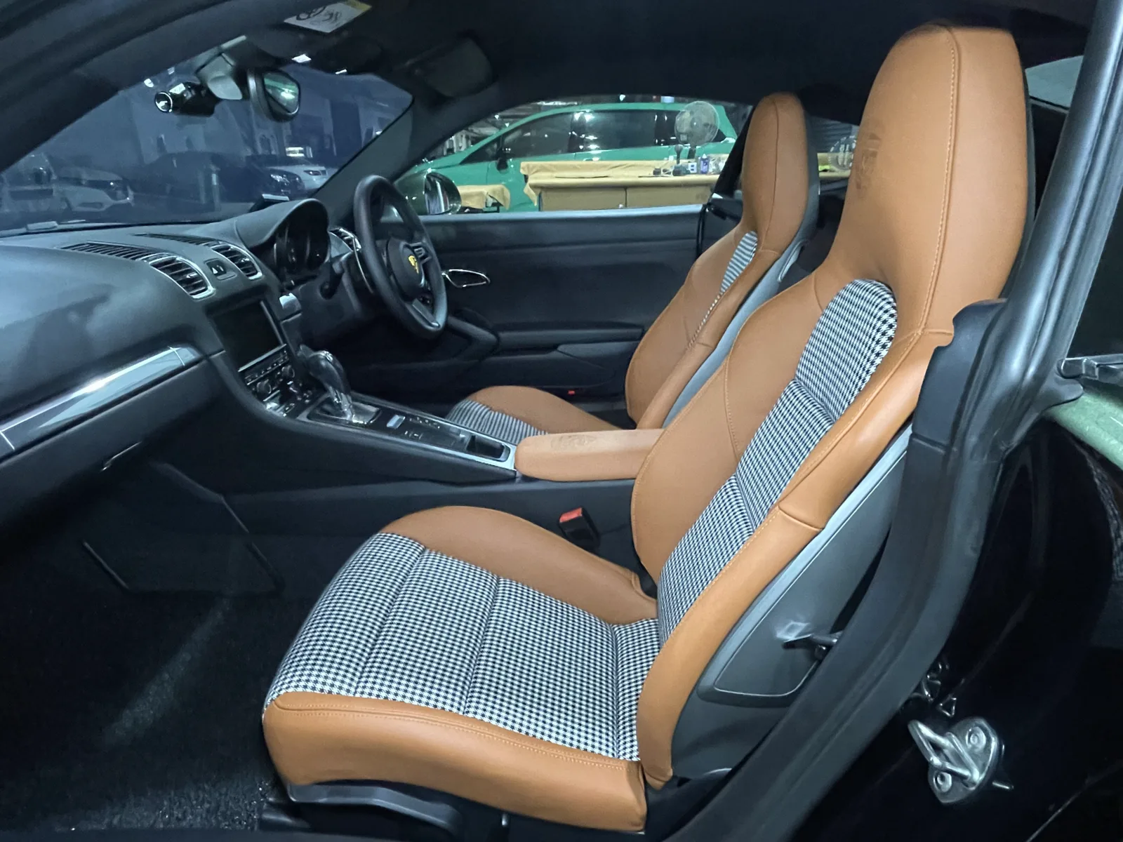 Porsche Cayman 981 interior with cognac leather and black-and-white Pepita-pattern seat upholstery