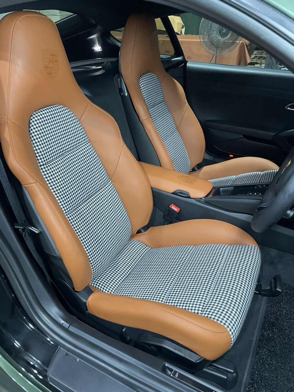 Side view of installed Porsche Cayman 981 seats after cognac leather and Pepita reupholstery