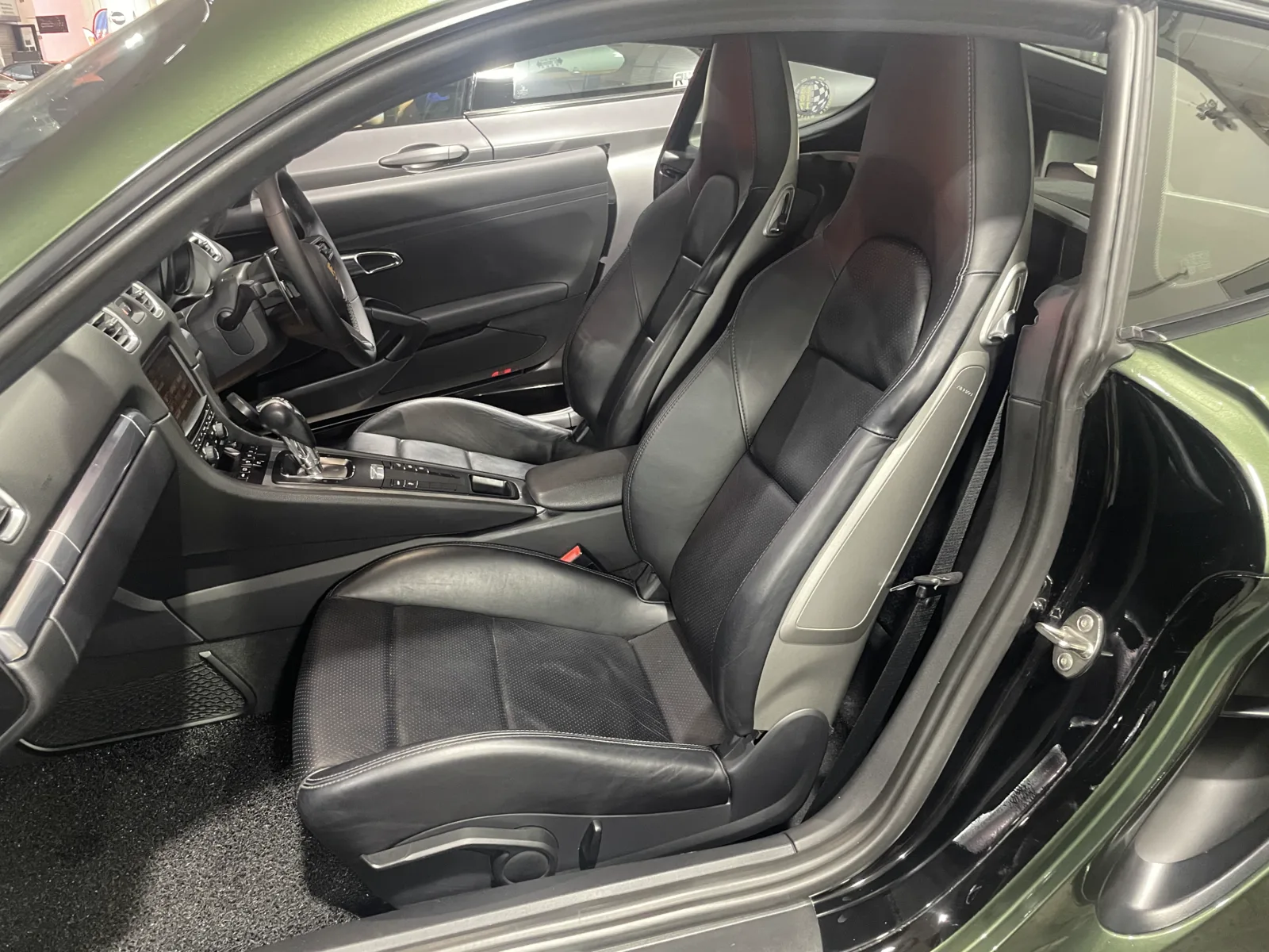 Original black Porsche Cayman 981 seats before upholstery replacement
