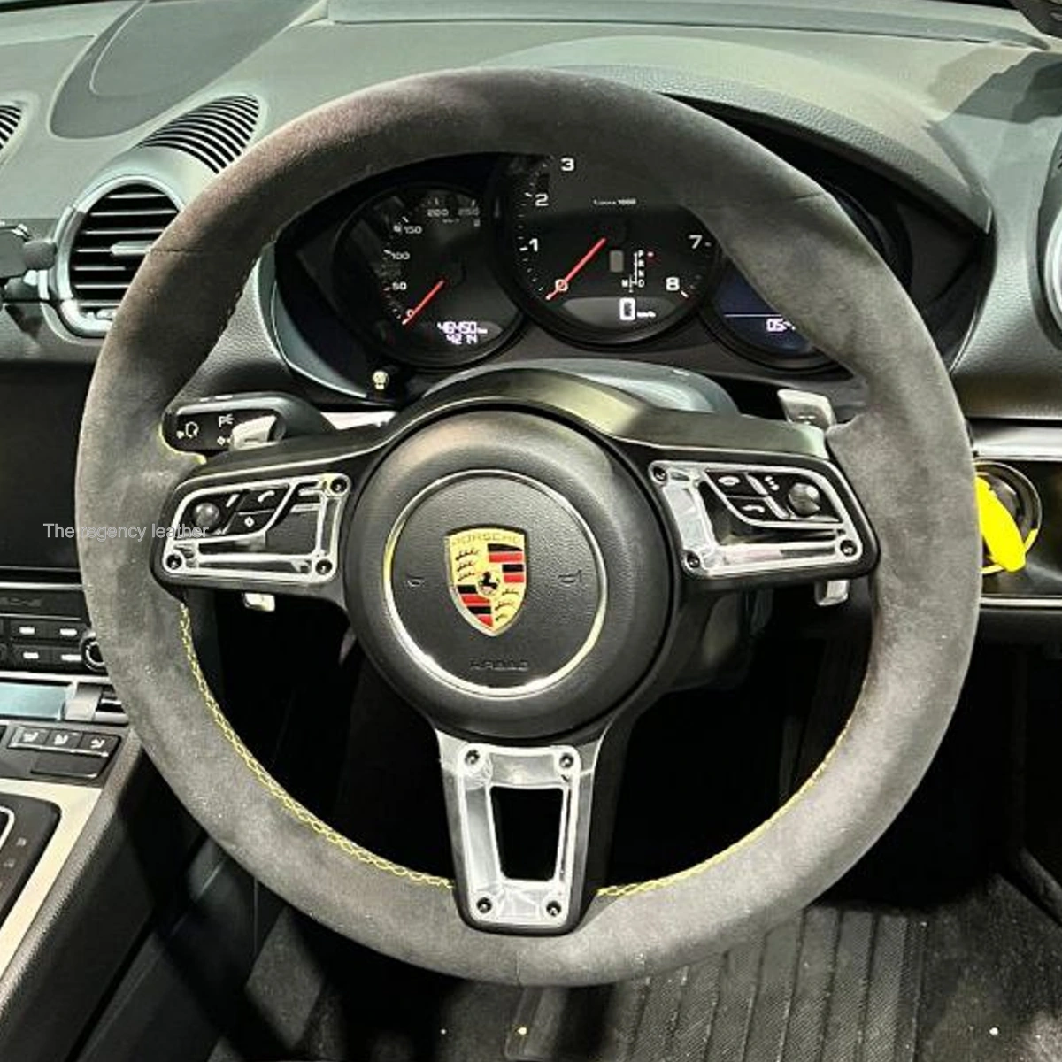 Porsche 718 Cayman GTS Alcantara steering wheel installed in cabin with body colour-matched stitching