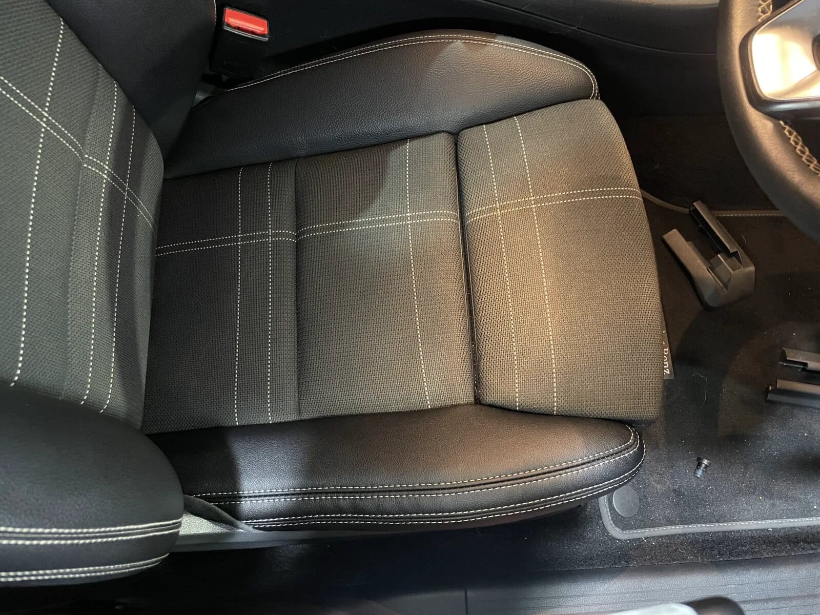 Angled view of repaired outer seat bolster after panel replacement